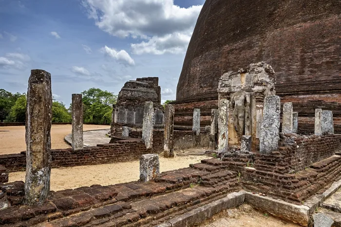 Framed Print : Architectural details and ruins of an ancient site next to a large stupa