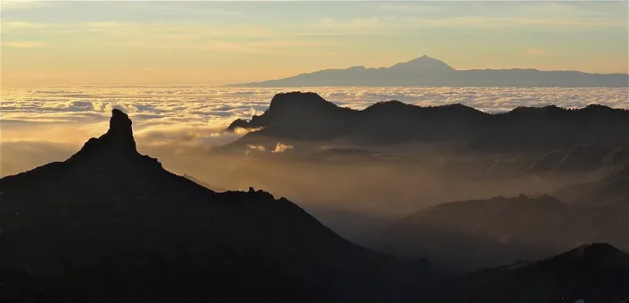 Framed Print : Atmospheric mountain scenery at sunset over a sea of clouds