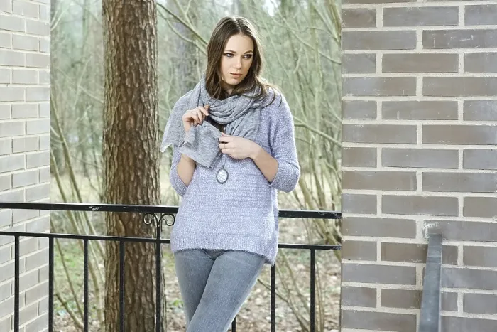 Framed Print : Attractive lady in sweater and scarf standing on balcony of the house in forest