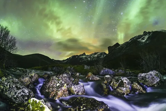 Framed Print : Aurora borealis over landscape with small river near the Sethaugelva lake in Tromvik