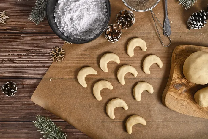 Framed Print : Baking traditional German or Austrian crescent shaped christmas cookies called Vanillekipferl' Baking
