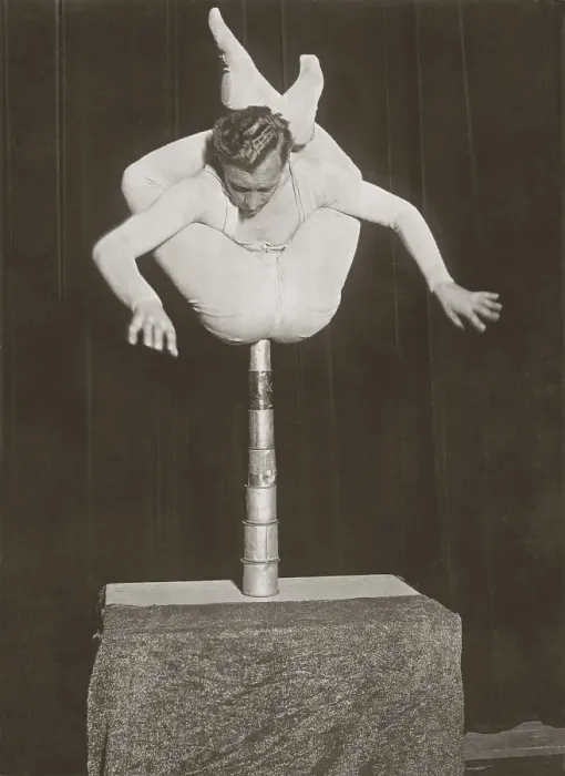 Framed Print : In balance 1930. A man seen balancing himself on top of tin cans Framed Print : In balance 1930. A man seen balancing himself on top of tin cans
