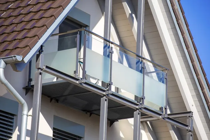 Framed Print : Balcony railing made of glass and stainless steel on a residential building