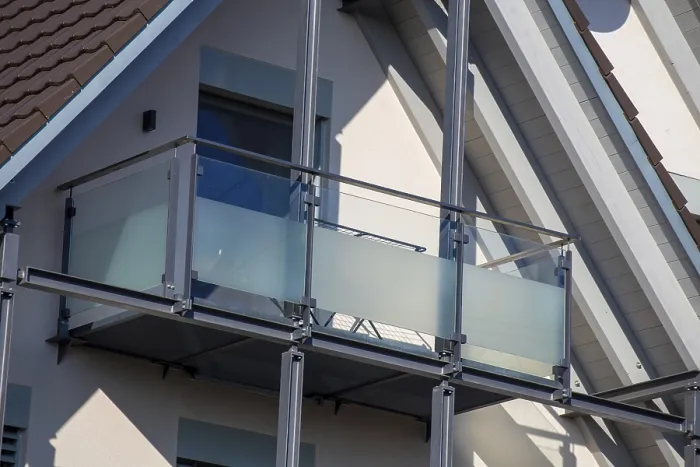 Framed Print : Balcony railing made of glass and stainless steel on a residential building