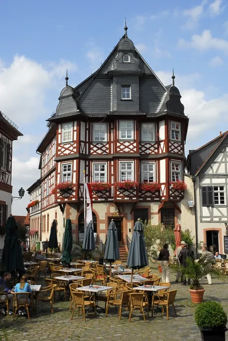 Framed Print : Bar cafe terrace, half-timbered houses in the back Framed Print : Bar cafe terrace, half-timbered houses in the back