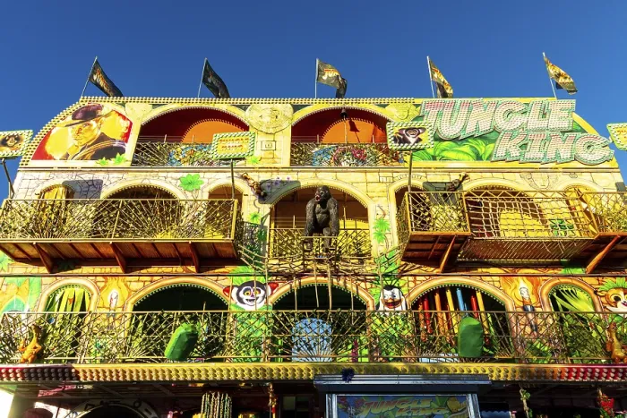 Framed Print : Barcelona, Catalonia - Spain - 01-07-2025: A large multi-story carnival funhouse named Jungle King with a jungle theme