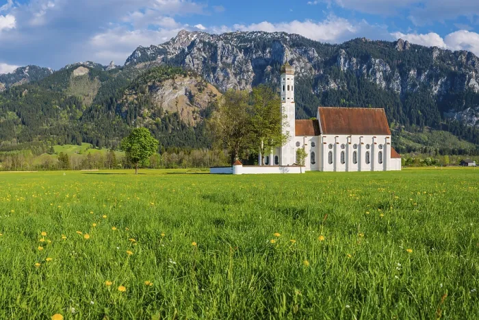 Framed Print : Baroque church of St. Coloman, behind it the Tegelberg mountain range