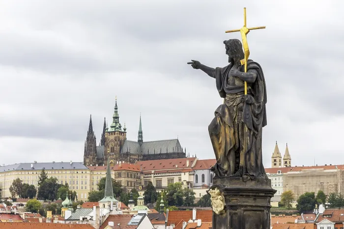 Framed Print : Baroque sculpture group Saint John the Baptist on historically mean Charles Bridge in Gothic style across the Vltava Framed Print : Baroque sculpture group Saint John the Baptist on historically mean Charles Bridge in Gothic style across the Vltava