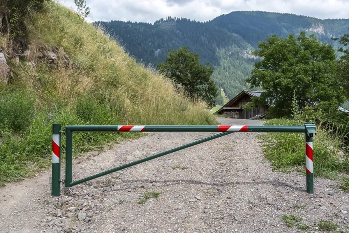 Framed Print : Barrier on gravel path in rural mountain region