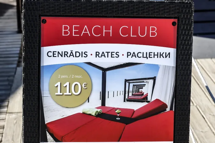 Framed Print : Beach club price table with information in several languages
