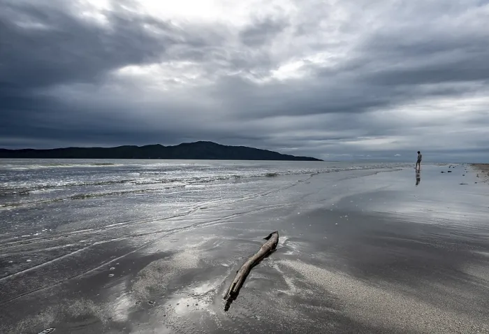 Framed Print : Beach Waikanae Beach with dramatic clouds