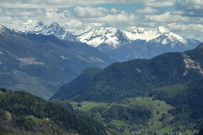 Framed Print : Beautiful aerial view of high snow-covered mountains and valley with village in Switzerland Framed Print : Beautiful aerial view of high snow-covered mountains and valley with village in Switzerland
