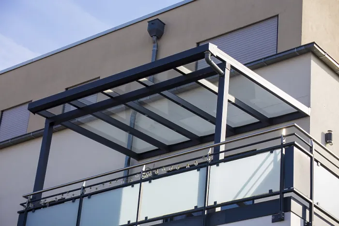 Framed Print : Beautiful balcony roofing made of glass and aluminium on a residential building