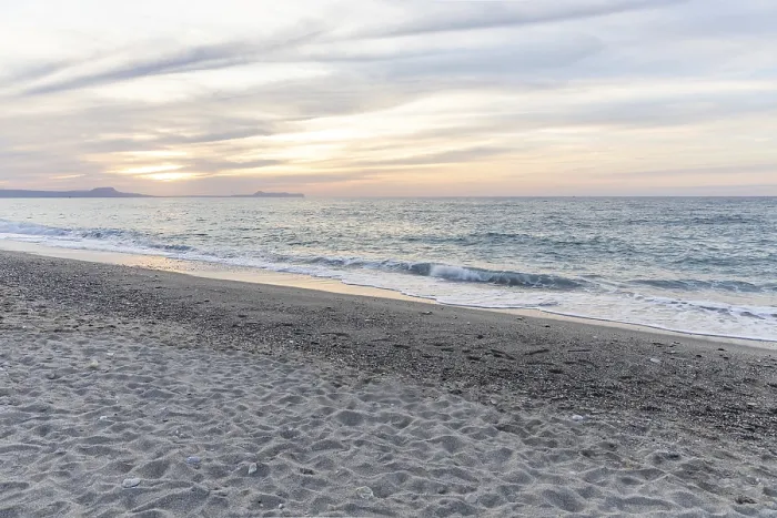 Framed Print : Beautiful coastline with a sandy beach and pebble beach at sunset Framed Print : Beautiful coastline with a sandy beach and pebble beach at sunset