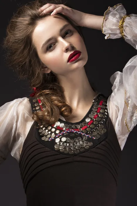 Framed Print : Beautiful Russian girl in national dress with a braid hairstyle and red lips