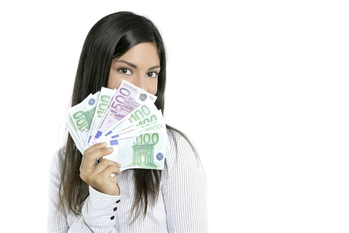 Framed Print : Beautiful sucess businesswoman holding Euro notes isolated on white
