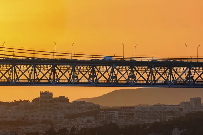 Framed Print : Beautiful view of golden sunset and suspension city bridge with its steel structure and cables