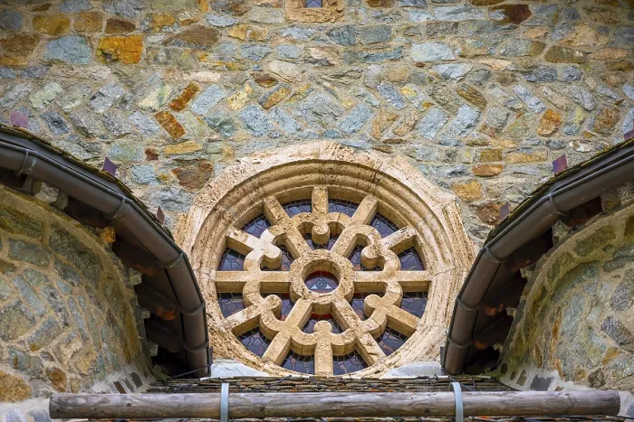 Framed Print : Beautiful Window with an Eye on an Old Church in Old Town in a Summer Day in Samedan