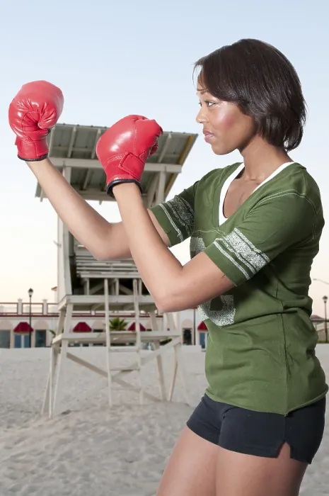 Framed Print : A beautiful young woman wearing a pair of boxing gloves Framed Print : A beautiful young woman wearing a pair of boxing gloves