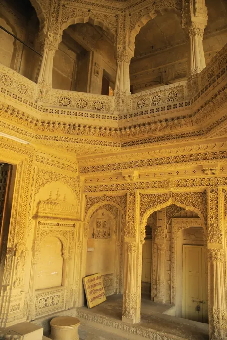 Framed Print : Several beautifully carved arch doors made by sandstones inside temple at Amarsagar Lake