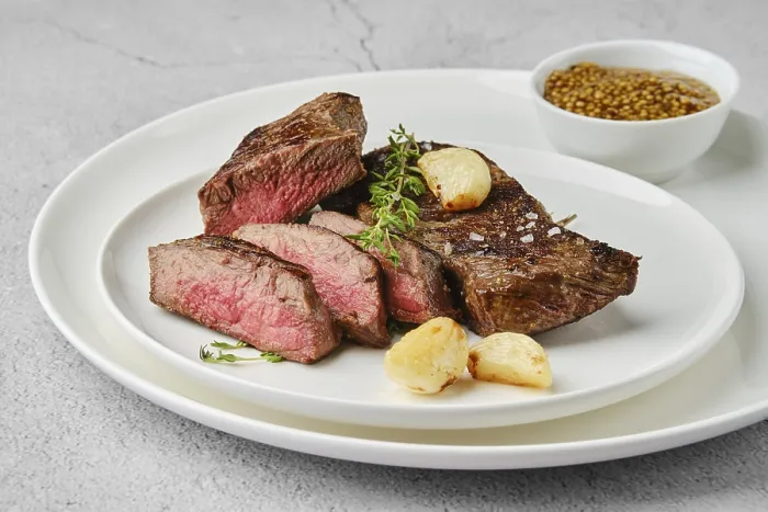 Framed Print : Beef strip steak medium rare on a plate