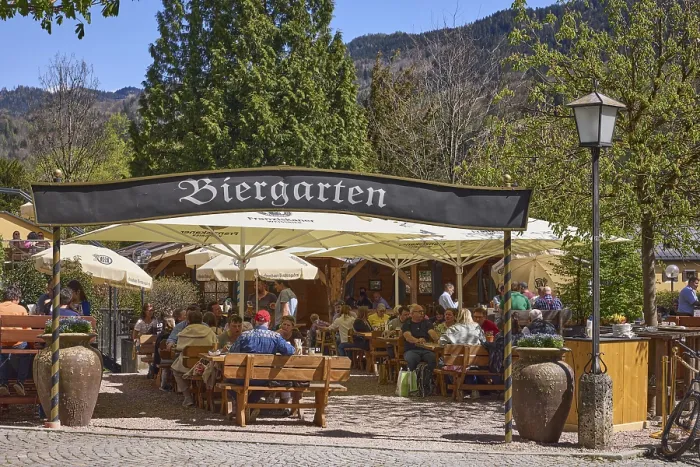 Framed Print : Beer garden, entrance, outdoor area of a restaurant with parasols