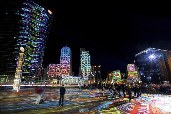 Framed Print : BERLIN - OCTOBER 07, 2018: Modern skyscraper at Potsdamer Platz in brightly colored illuminations