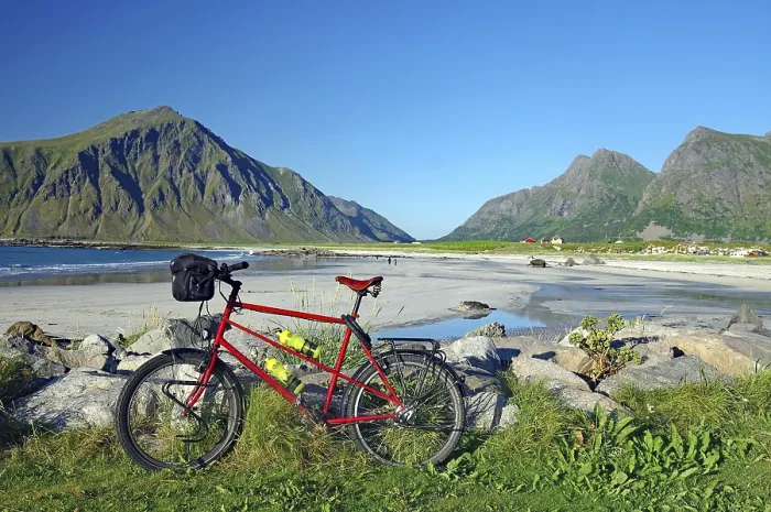 Framed Print : A bicycle on the beach with a view of the surrounding mountains and the sea