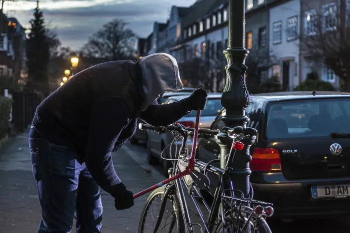 Framed Print : Bicycle theft, thief with bolt cutters