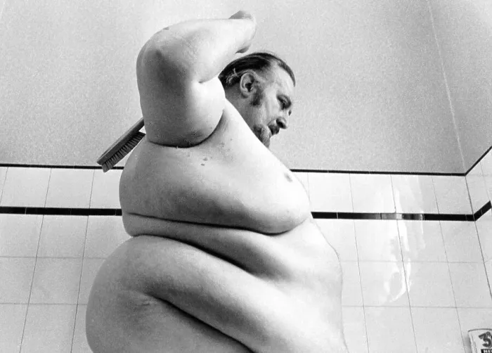 Framed Print : Big man washes himself, England, Great Britain Framed Print : Big man washes himself, England, Great Britain