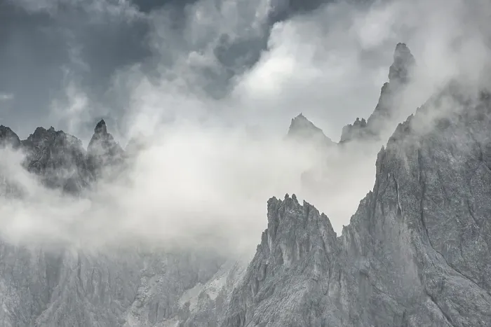 Framed Print : Bizarre mountain peaks with dramatic clouds