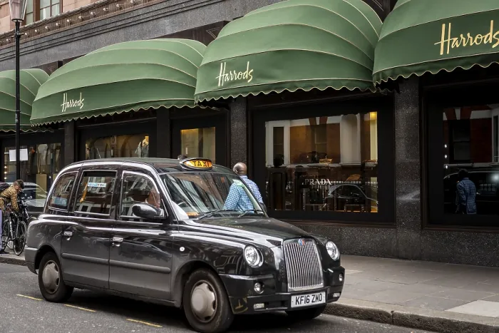 Framed Print : Black London Taxi outside the luxury department stores