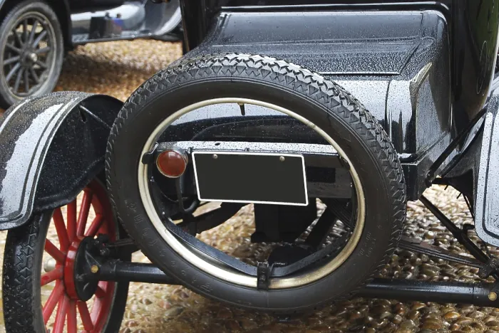 Framed Print : Black retro car back side, spare wheel closeup Framed Print : Black retro car back side, spare wheel closeup