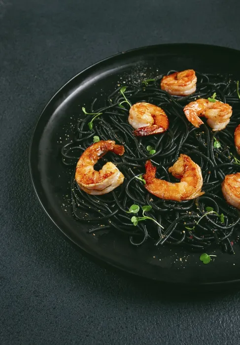Framed Print : Black spaghetti with shrimp, on a black plate Framed Print : Black spaghetti with shrimp, on a black plate