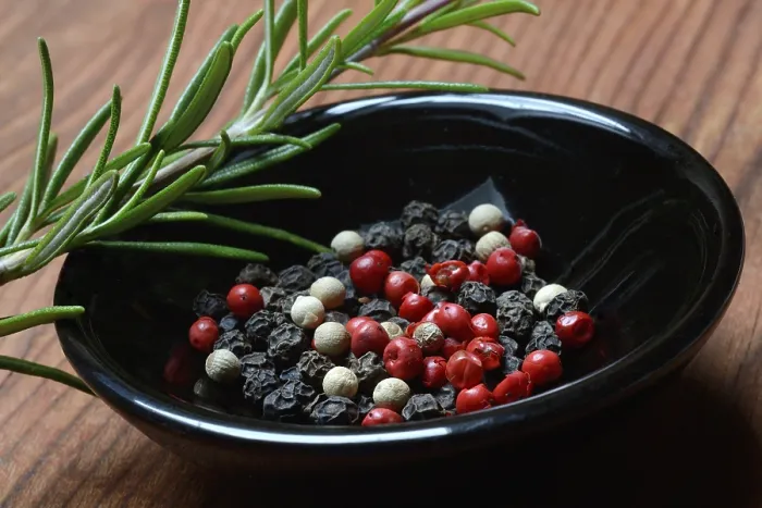 Framed Print : Black and white peppercorns in shell