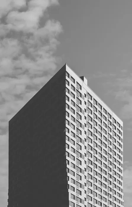Framed Print : Black and White Skyscraper on the Cloudy Sky Background Framed Print : Black and White Skyscraper on the Cloudy Sky Background
