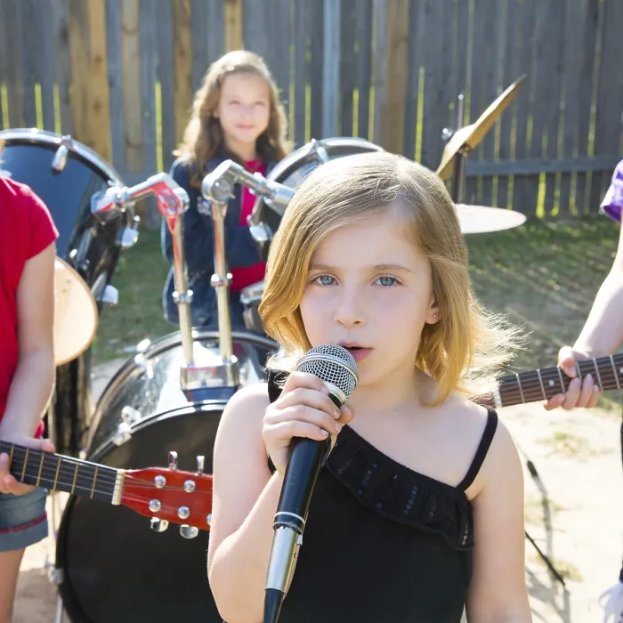 Framed Print : Blond kid singer girl singing playing live band in backyard concert with friends