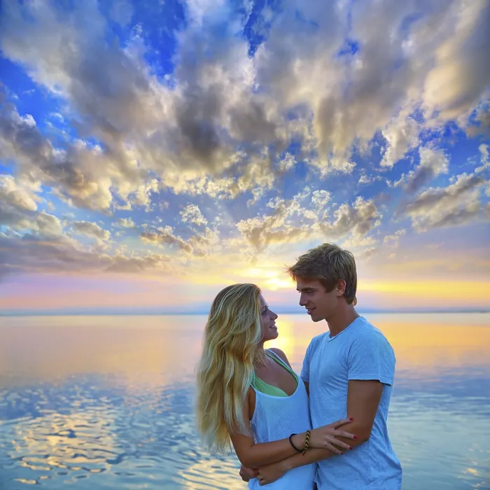 Framed Print : Blond young couple hug in sunset sea lake happy together