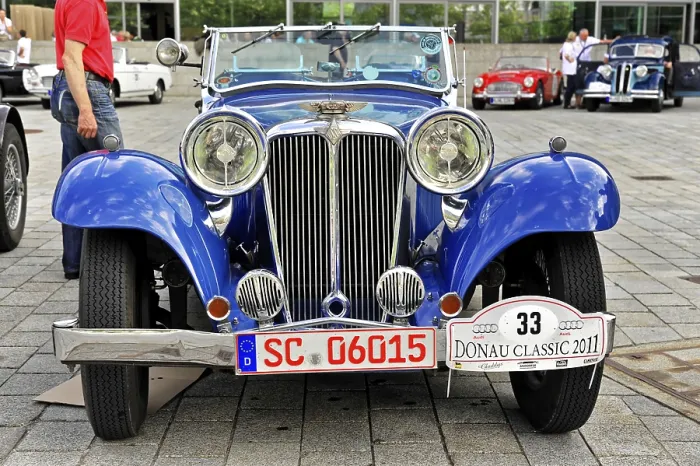 Framed Print : Blue classic classic car with distinctive headlights and nostalgic license plate