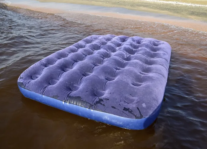 Framed Print : Blue inflatable mattress swimming in the pond Framed Print : Blue inflatable mattress swimming in the pond