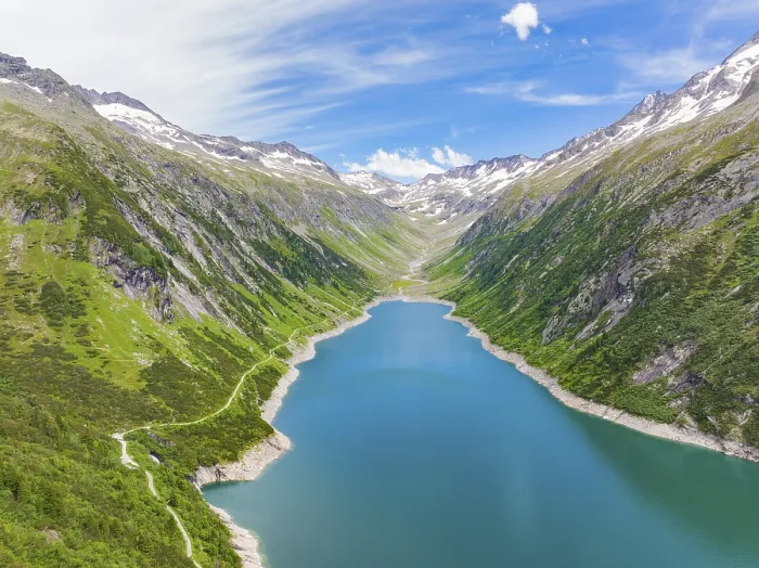 Framed Print : Blue lake, surrounded by high mountains and green Framed Print : Blue lake, surrounded by high mountains and green
