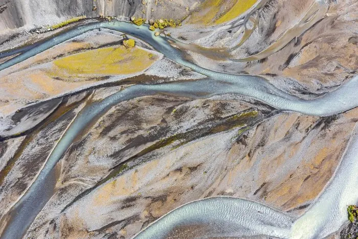 Framed Print : Blue river arms flowing through lava sand Framed Print : Blue river arms flowing through lava sand
