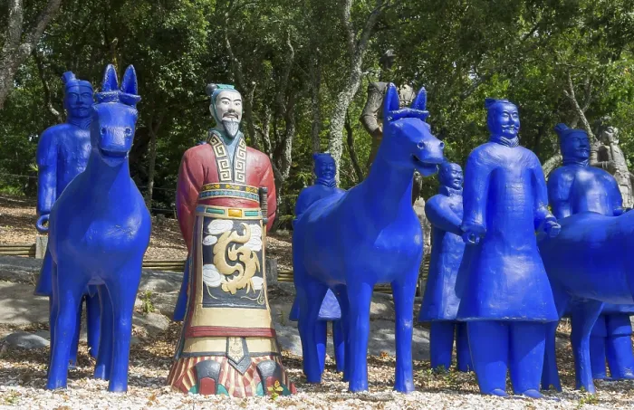 Framed Print : Blue terracotta soldiers and horse statues with a painted soldier in a forest