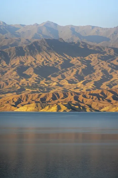Framed Print : Blue Toktogul reservoir between dry mountain landscape Framed Print : Blue Toktogul reservoir between dry mountain landscape