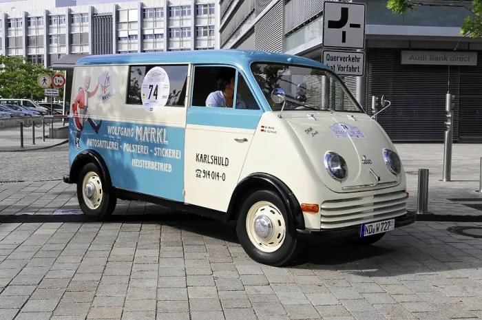 Framed Print : Blue and white vintage van with advertising lettering and number 74 on cobblestones
