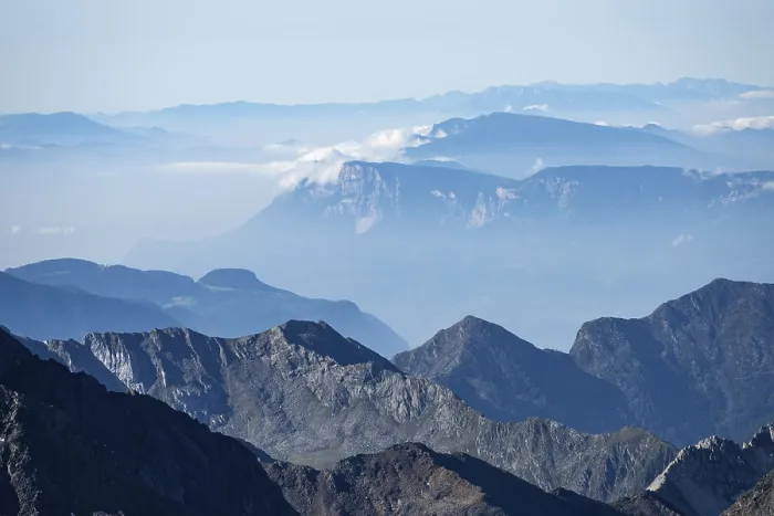 Framed Print : Blurred mountains in fog against a clear blue sky offer tranquil views Framed Print : Blurred mountains in fog against a clear blue sky offer tranquil views