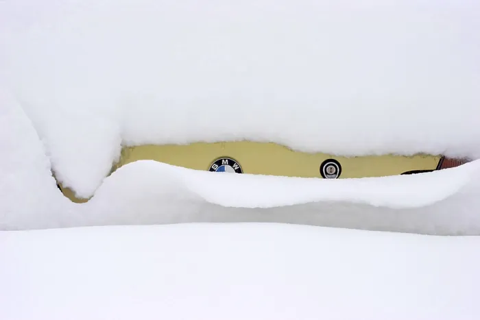 Framed Print : A BMW oldtimer completely covered in snow Framed Print : A BMW oldtimer completely covered in snow