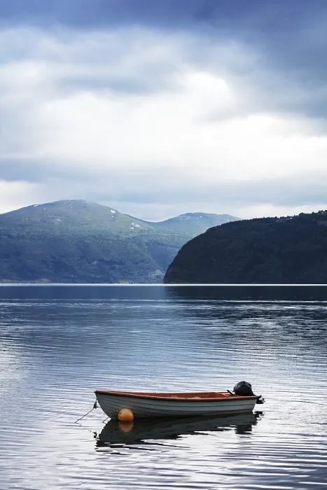 Framed Print : Boat on water fjord with mountains in Norway