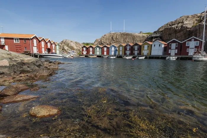 Framed Print : Boats and colourful boathouses in the harbour of Smoegen