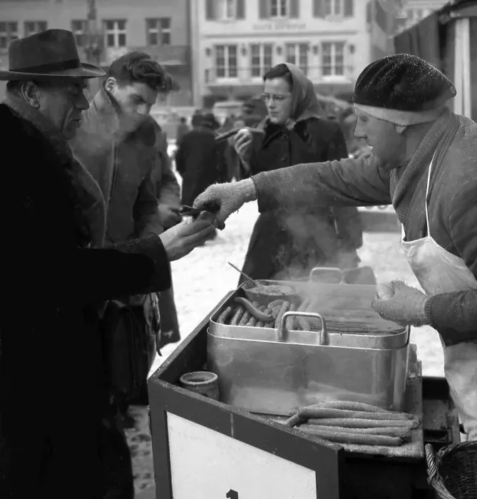 Framed Print : Bockwurst salesman in winter on a street in Freiburg